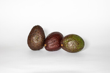 three avocados