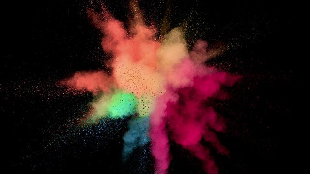 Super slow motion of colored powder explosion isolated on black background. Speed ramp effect. Filmed on high speed cinema camera, 1000fps.