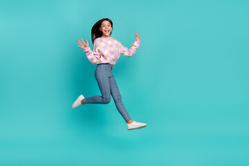 Fototapeta na wymiar Full length body size view of attractive cheery girl jumping walking good mood isolated over bright teal turquoise color background
