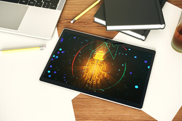 Modern digital tablet monitor with creative light bulb hologram and chip, idea and brainstorming concept. Top view. 3D Rendering