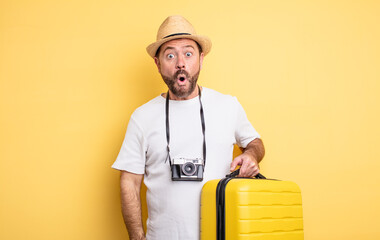 middle age man tourist looking very shocked or surprised. travel concept