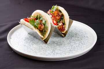 Bao, steamed rice buns, with chicken.