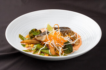 Sea bass fillet, with smoked paprika and WOK vegetables.