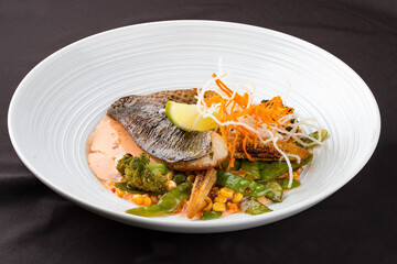 Sea bass fillet, with smoked paprika and WOK vegetables.