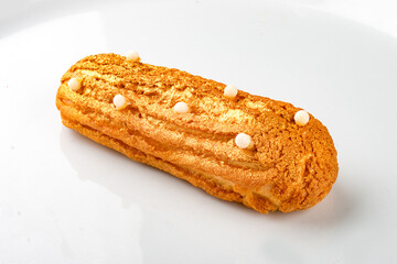 Eclair. Custard cake with buttercream.