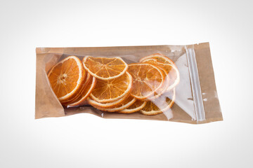 Orange fripses. Dried orange packaged on a white background, vegan snack.