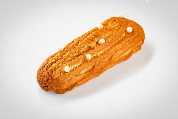 Eclair. Custard cake with buttercream.