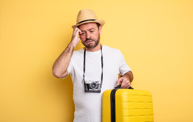 middle age man tourist feeling bored, frustrated and sleepy after a tiresome. travel concept