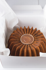 Bundt cake in a white bakery box