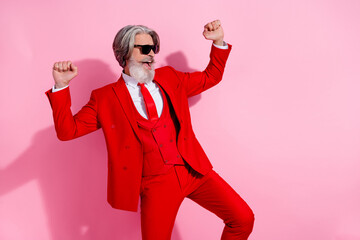 Photo of pretty lucky man pensioner dressed red jacket dancing rising fists empty space isolated...