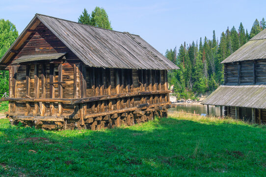 An old wooden complex of the salt industry, built in the 19th century. Salt factory. Wooden large old buildings made of logs. Wooden salt storage building.
