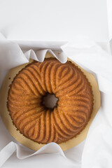 Bundt cake in a white bakery box