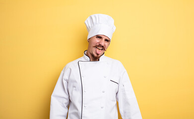 chef man with cheerful and rebellious attitude, joking and sticking tongue out