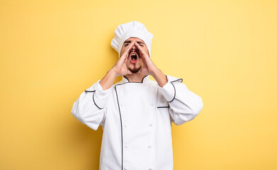 chef man feeling happy,giving a big shout out with hands next to mouth