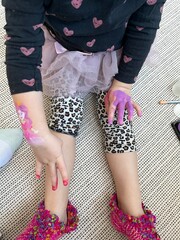 Girl with body-art princess. Pink paint and little baby