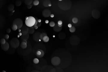 Black bokeh blur abstract background. Christmas and New year