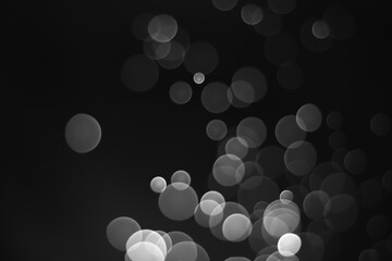 Black bokeh blur abstract background. Christmas and New year