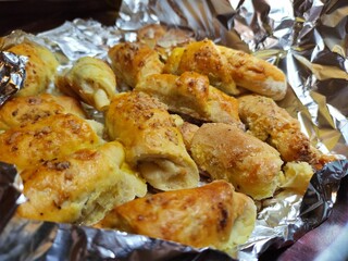 Homemade rolled buns with walnuts wrapped in the foil