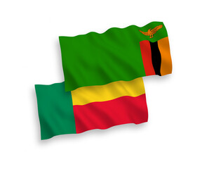 National vector fabric wave flags of Republic of Zambia and Benin isolated on white background. 1 to 2 proportion.