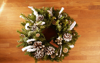 Beautiful Christmas fir crown decoration made of natural accessories like dried fruits. Amazing...