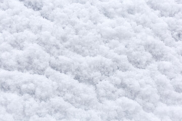 Backdrop of snow texture. Beautiful winter background. Space for text. Top view.