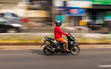 Fototapeta na wymiar Random Motorbiker at the street