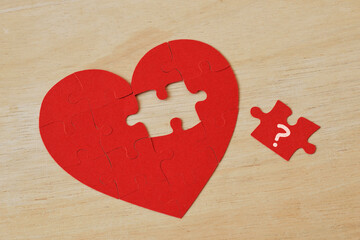 Heart shaped puzzle with missing piece - Concept of love and troubles