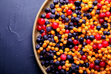 Frozen berries. Blueberries, sea buckthorn, cranberries and blueberries. Healthy eating concept.