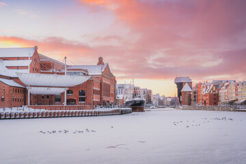 Amazing view of the snow-covered Gdańsk Crane in the morning in winter. © Kamil