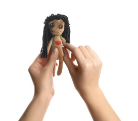 Woman stabbing voodoo doll with pin on white background, closeup