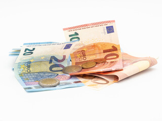 Euro money, coins and banknotes on white background