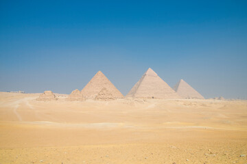 Landscape of the pyramids in the desert with blue sky in Giza, Egypt