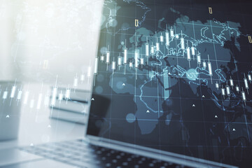 Double exposure of abstract creative financial chart with world map on laptop background, research and strategy concept