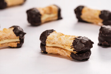 Artisanal almond chocolate biscuits called bokkepootjes on a marble surface - obrazy, fototapety, plakaty