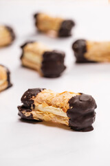Artisanal almond chocolate biscuits called bokkepootjes on a marble surface