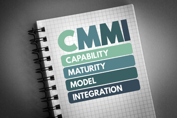 CMMI - Capability Maturity Model Integration acronym on notepad, technology concept background