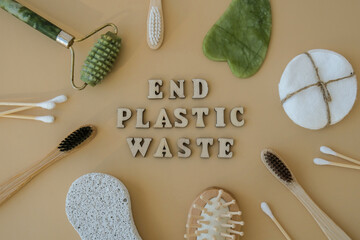 END PLASTIC WASTE text around Natural skin care products on neutral beige background, flat lay....
