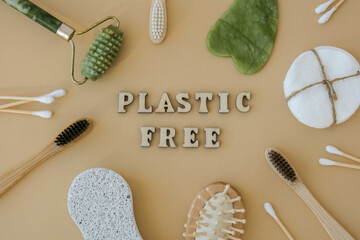 END PLASTIC WASTE text around Natural skin care products on neutral beige background, flat lay....