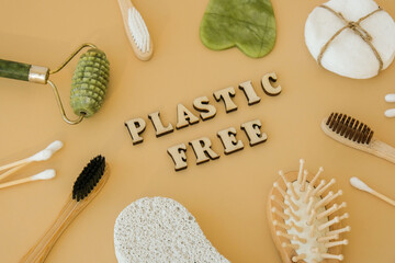 PLASTIC FREE text around Natural skin care products on neutral beige background, flat lay. Concept...