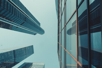 glass houses, office, against a blue sky, photo in the afternoon