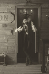 woman with smoking gun in the wild west