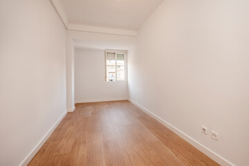 Fototapeta na wymiar empty room freshly painted with window and oak flooring