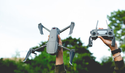 unmanned aerial photography equipment drone Hands and drones with camera taking 4k video