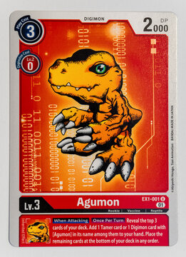 Hamburg, Germany - 12282021: top shot photo of the English Digimon paper trading card Agumon from the Classic Collection EX01 series.