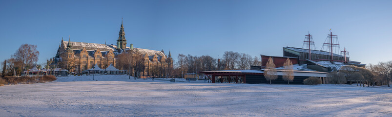 Snowy view with a gothic museum and a ship museum building, on the island Djurgården a sunny winter day in Stockholm