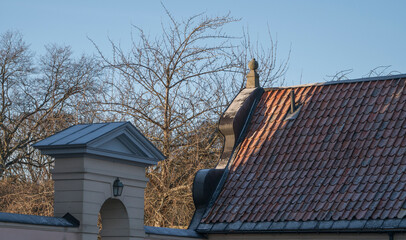 Roofs of old profane castle building from 1650s, Hässelby slott a sunny frosty winter day in Stockholm