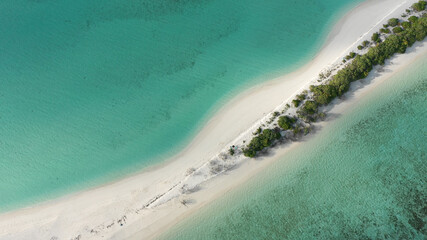 Aerial view of a tropical island with a sandbank, surrounded by turquoise water. Dhigurah island, Maldives. © Kertu