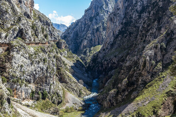 Famous hiking trail between mountains bordering the Cares river in Asturias Spain