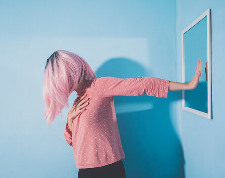 Woman showing hand to mirror at home