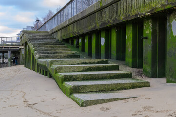 Fototapeta na wymiar Steps leading down to the River Thames riverbank. at Bankside, London, UK